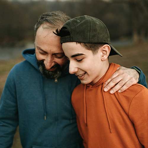 Father and son walk together in nature